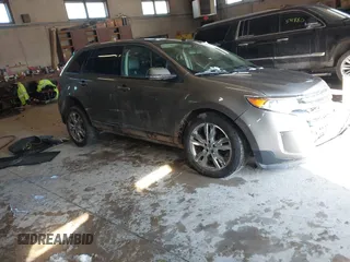 2014 Ford Edge SEL z VIN 2FMDK4JCXEBB13032, wystawiony jako IAAI lot #41879552 z przebiegiem 211 008 mil mil oraz . Historia ofert i sprzedaży dostępna na DreamBid. Obrazek 1.