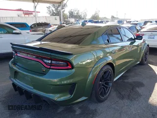 2022 Dodge Charger Scat Pack Widebody with VIN 2C3CDXGJ1NH216763, listed as a IAAI auction lot 41259159 with 32,610 mi miles and . Bid and sale history available at DreamBid. Image 4.