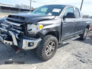 2016 Toyota Tundra 4WD Truck SR with VIN 5TFUW5F19GX548996, listed as a IAAI auction lot 41607605 with 101,194 mi miles. Bid and sale history available at carsss.com. Image 2.