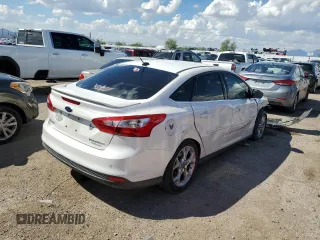2014 Ford Focus Titanium with VIN 1FADP3J26EL132223, listed as a Copart auction lot 71490004 with 131,233 mi miles and Salvage Title. Bid and sale history available at DreamBid. Image 3.