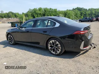 2024 BMW 5 Series 530i xDrive with VIN WBA53FJ04RCP87607, listed as a Copart auction lot 58768065 with 11,596 mi miles and Salvage title. Bid and sale history available at DreamBid. Image 2.