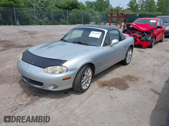 2002 Mazda MX-5 Miata Cloth with VIN JM1NB353420219700, listed as a IAAI auction lot 42510532 with 168,498 mi miles and . Bid and sale history available at DreamBid. Image 2.