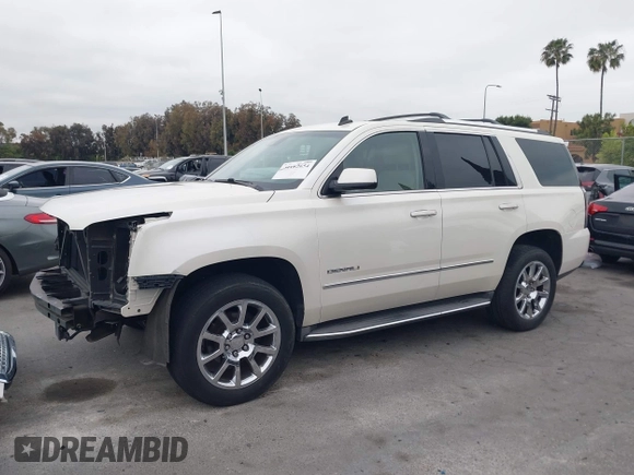 2015 GMC Yukon Denali with VIN 1GKS2CKJ9FR294551, listed as a IAAI auction lot 42162654 with 106,063 mi miles. Bid and sale history available at carsss.com. Image 15.