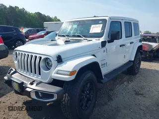 2021 Jeep Wrangler Unlimited Sahara z VIN 1C4JJXP6XMW840844, wystawiony jako IAAI lot #42152271 z przebiegiem 68 209 mil mil oraz . Historia ofert i sprzedaży dostępna na DreamBid. Obrazek 2.