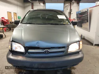 1999 Toyota Sienna CE with VIN 4T3GF19C5XU139787, listed as a IAAI auction lot 41167781 with 217,715 mi miles. Bid and sale history available at carsss.com. Image 12.