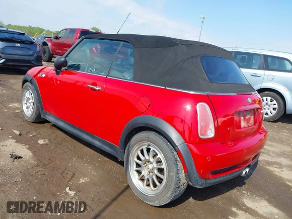 2006 MINI Convertible S with VIN WMWRH33596TK58563, listed as a IAAI auction lot 42210790 with 102,476 mi miles and . Bid and sale history available at DreamBid. Image 3.