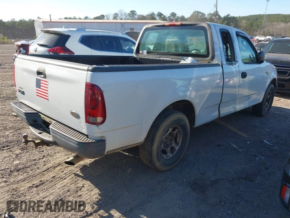 2003 Ford F-150 XL with VIN 1FTRX17W33NA66469, listed as a IAAI auction lot 41677909 with 236,619 mi miles. Bid and sale history available at carsss.com. Image 4.