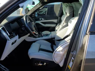 2021 BMW X5 M with VIN 5YMJU0C01M9F10602, listed as a Copart auction lot 65668883 with 23,214 mi miles. Bid and sale history available at carsss.com. Image 7.