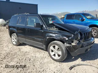 2014 Jeep Patriot Latitude with VIN 1C4NJRFB5ED855888, listed as a Copart auction lot 57969355 with 113,196 mi miles and Salvage title. Bid and sale history available at DreamBid. Image 4.