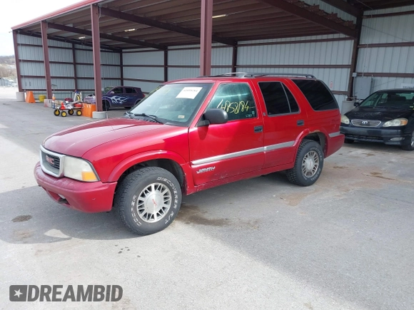 1999 GMC Jimmy SLE with VIN 1GKDT13W3X2504723, listed as a IAAI auction lot 41858184 with 239,227 mi miles. Bid and sale history available at carsss.com. Image 2.