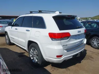 2014 Jeep Grand Cherokee Overland with VIN 1C4RJFCTXEC128443, listed as a IAAI auction lot 40512681 with 126,379 mi miles. Bid and sale history available at carsss.com. Image 3.