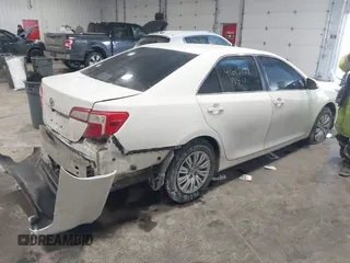 2014 Toyota Camry L with VIN 4T1BF1FK4EU763009, listed as a IAAI auction lot 41615134 with 165,293 mi miles and . Bid and sale history available at carsss.com. Image 4.