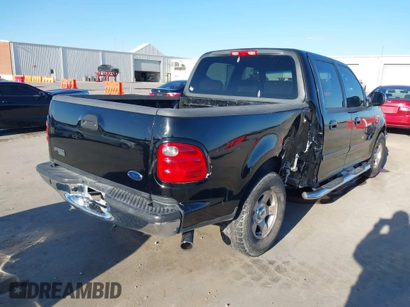 2002 Ford F-150 XLT with VIN 1FTRW07622KD31203, listed as a IAAI auction lot 41401506 with 166,949 mi miles. Bid and sale history available at carsss.com. Image 4.