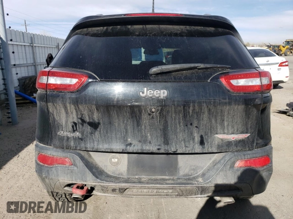2016 Jeep Cherokee Trailhawk with VIN 1C4PJMBSXGW131199, listed as a Copart auction lot 49292505 with 97,359 mi miles and Salvage Title. Bid and sale history available at DreamBid. Image 6.
