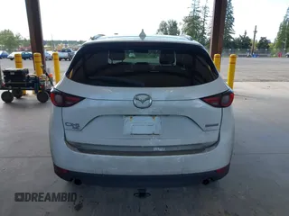 2020 Mazda CX-5 Grand Touring with VIN JM3KFBDM2L0863944, listed as a IAAI auction lot 42150805 with 63,932 mi miles and . Bid and sale history available at DreamBid. Image 16.