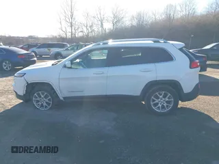 2015 Jeep Cherokee Latitude with VIN 1C4PJMCB3FW734573, listed as a IAAI auction lot 41825561 with 141,250 mi miles. Bid and sale history available at carsss.com. Image 15.