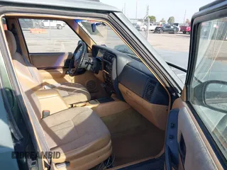 1997 Jeep Cherokee Country with VIN 1J4FT78S1VL522295, listed as a IAAI auction lot 42481630 with 340,239 mi miles and . Bid and sale history available at DreamBid. Image 5.