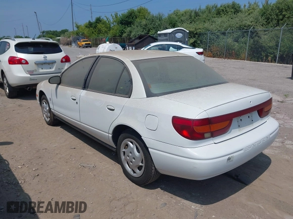 2002 Saturn SL z VIN 1G8ZK52772Z218812, wystawiony jako IAAI lot #42763871 z przebiegiem 86 338 mil mil oraz . Historia ofert i sprzedaży dostępna na DreamBid. Obrazek 3.