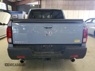 2023 Honda Ridgeline RTL-E with VIN 5FPYK3F77PB001460, listed as a Copart auction lot 61383785 with 27,423 mi miles and Salvage title. Bid and sale history available at DreamBid. Image 6.