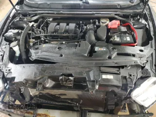 2015 Ford Taurus Limited with VIN 1FAHP2F8XFG184733, listed as a Copart auction lot 48056685 with 131,649 mi miles and Salvage Title. Bid and sale history available at carsss.com. Image 11.