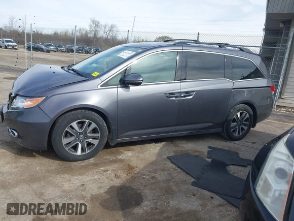 2016 Honda Odyssey Touring Elite z VIN 5FNRL5H99GB072860, wystawiony jako IAAI lot #42157603 z przebiegiem 221 449 mil mil oraz . Historia ofert i sprzedaży dostępna na DreamBid. Obrazek 14.
