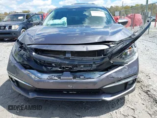 2021 Honda Civic Sedan EX with VIN 19XFC1F33ME012262, listed as a IAAI auction lot 41880047 with 67,861 mi miles. Bid and sale history available at carsss.com. Image 6.