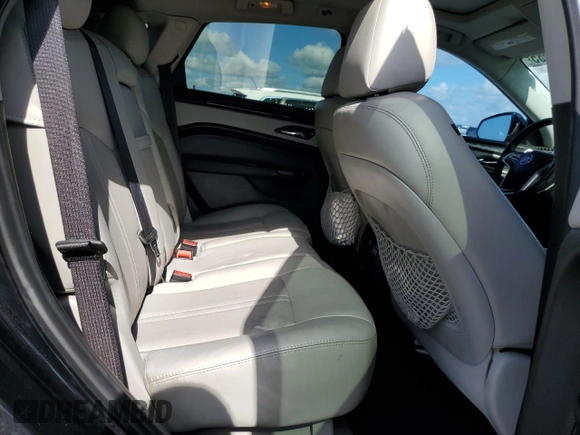 2013 Cadillac SRX Performance Collection with VIN 3GYFNHE37DS649235, listed as a Copart auction lot 56939285 with 104,692 mi miles and Salvage title. Bid and sale history available at DreamBid. Image 11.