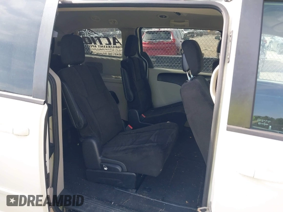 2012 Dodge Grand Caravan SXT with VIN 2C4RDGCGXCR358794, listed as a IAAI auction lot 42007316 with 212,518 mi miles and . Bid and sale history available at DreamBid. Image 8.