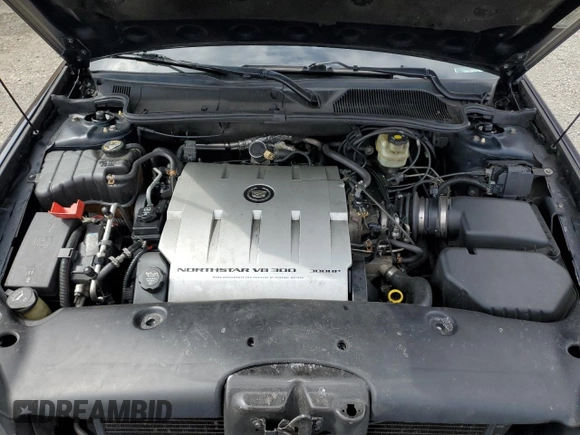 2004 Cadillac DeVille DTS z VIN 1G6KF579X4U203102, wystawiony jako Copart lot #50426955 z przebiegiem 157 290 mil mil oraz Szkody całkowita. Historia ofert i sprzedaży dostępna na DreamBid. Obrazek 11.