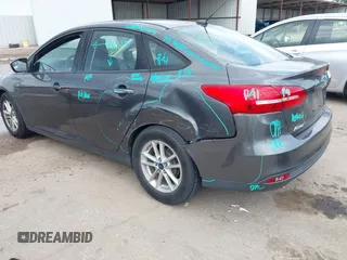 2017 Ford Focus SE with VIN 1FADP3F23HL232809, listed as a IAAI auction lot 42117700 with 104,802 mi miles and . Bid and sale history available at DreamBid. Image 3.