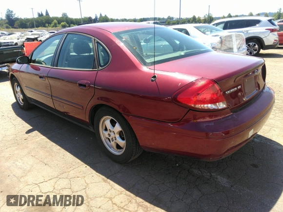 2005 Ford Taurus SE with VIN 1FAFP53U85A129306, listed as a IAAI auction lot 40585457 with 329,569 mi miles. Bid and sale history available at carsss.com. Image 3.