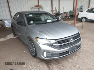 2023 Volkswagen Jetta Sport with VIN 3VWBM7BU8PM051563, listed as a IAAI auction lot 42118558 with 28,378 mi miles and . Bid and sale history available at DreamBid. Image 1.