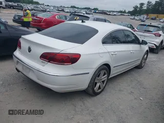 2014 Volkswagen CC R-Line with VIN WVWBP7AN7EE534565, listed as a IAAI auction lot 42477774 with 85,539 mi miles and . Bid and sale history available at DreamBid. Image 4.