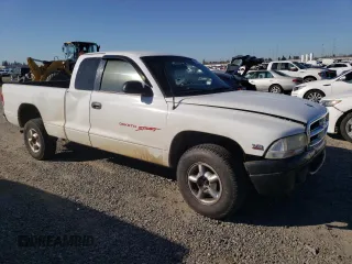 1999 Dodge Dakota SLT with VIN 1B7GG22Y6XS119274, listed as a Copart auction lot 46947005 with 264,537 mi miles and Salvage Title. Bid and sale history available at DreamBid. Image 4.