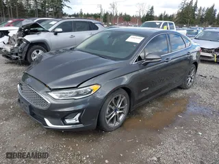 2019 Ford Fusion Hybrid Titanium with VIN 3FA6P0RU8KR273062, listed as a IAAI auction lot 41814102 with 70,877 mi miles. Bid and sale history available at carsss.com. Image 17.