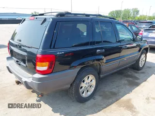 2001 Jeep Grand Cherokee Laredo with VIN 1J4GW48S31C558946, listed as a IAAI auction lot 42384392 with 252,393 mi miles and . Bid and sale history available at DreamBid. Image 4.