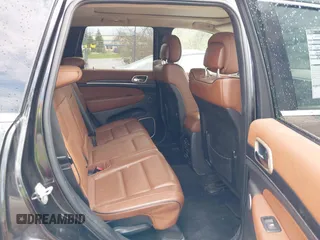 2015 Jeep Grand Cherokee Summit with VIN 1C4RJFJGXFC882787, listed as a IAAI auction lot 42098274 with 147,020 mi miles and . Bid and sale history available at DreamBid. Image 8.