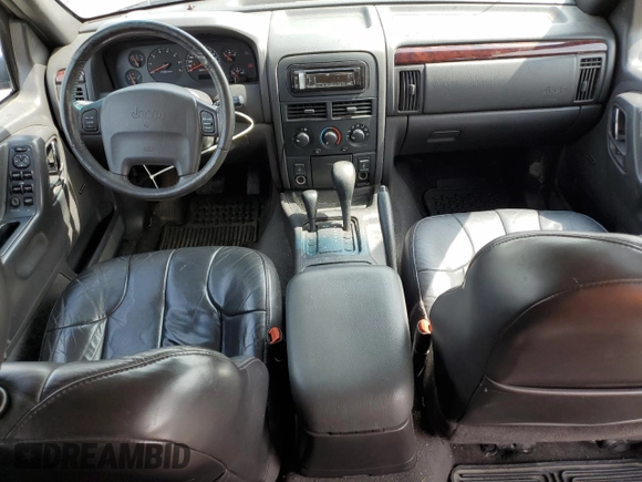 2000 Jeep Grand Cherokee Laredo with VIN 1J4GW48N1YC324356, listed as a Copart auction lot 62011305 with 242,322 mi miles and Salvage title. Bid and sale history available at DreamBid. Image 8.
