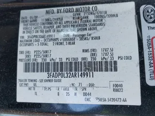 2010 Ford Fusion Hybrid with VIN 3FADP0L32AR149911, listed as a IAAI auction lot 41636037 with 148,431 mi miles. Bid and sale history available at carsss.com. Image 9.