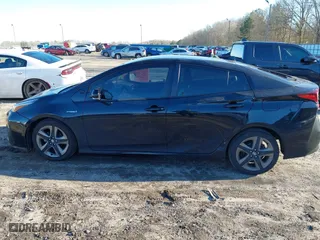 2019 Toyota Prius L Eco with VIN JTDKARFU9K3091887, listed as a IAAI auction lot 41282017 with 240,000 mi miles. Bid and sale history available at carsss.com. Image 6.