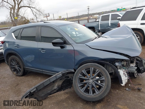 2023 Mazda CX-5 S Carbon Edition z VIN JM3KFBCM9P0109219, wystawiony jako IAAI lot #41183435 z przebiegiem Nie podano mil oraz . Historia ofert i sprzedaży dostępna na DreamBid. Obrazek 13.