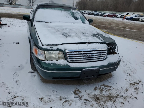 2000 Ford Crown Victoria with VIN 2FAFP73WXYX157746, listed as a Copart auction lot 82748804 with 56,820 mi miles and Salvage Title. Bid and sale history available at carsss.com. Image 5.