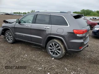 2017 Jeep Grand Cherokee Overland with VIN 1C4RJFCG8HC607872, listed as a Copart auction lot 57493195 with 164,478 mi miles and Salvage title. Bid and sale history available at DreamBid. Image 2.