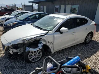 2014 Mazda 3 i Touring z VIN JM1BM1V71E1191163, wystawiony jako Copart lot #57904375 z przebiegiem 143 594 mil mil oraz Szkoda całkowita • Salvage title. Historia ofert i sprzedaży dostępna na DreamBid. Obrazek 1.
