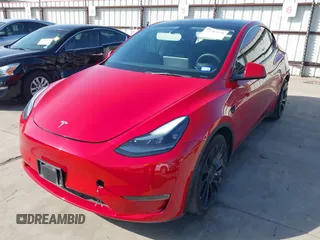2022 Tesla Model Y Performance z VIN 7SAYGDEF0NF518740, wystawiony jako IAAI lot #41785358 z przebiegiem 50 692 mil mil oraz . Historia ofert i sprzedaży dostępna na DreamBid. Obrazek 22.