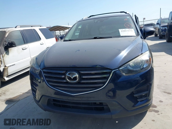 2016 Mazda CX-5 Grand Touring z VIN JM3KE2DY3G0797321, wystawiony jako IAAI lot #42017174 z przebiegiem 65 505 mil mil oraz . Historia ofert i sprzedaży dostępna na DreamBid. Obrazek 12.