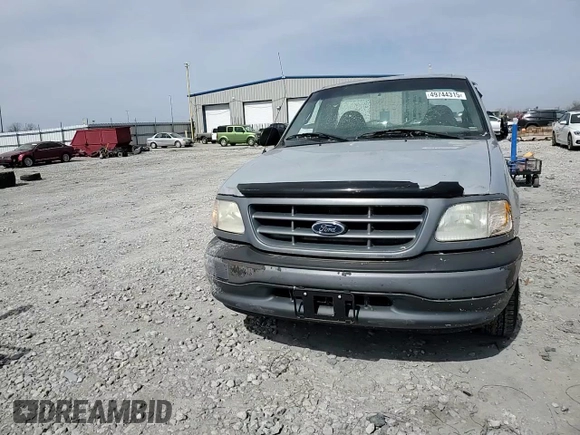 2001 Ford F-150 XL z VIN 2FTZF17261CA31704, wystawiony jako Copart lot #49744315 z przebiegiem 165 613 mil mil oraz Szkoda całkowita • Salvage title. Historia ofert i sprzedaży dostępna na DreamBid. Obrazek 11.