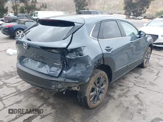 2022 Mazda CX-30 S Carbon Edition with VIN 3MVDMBCL0NM456154, listed as a IAAI auction lot 42153202 with 40,372 mi miles and . Bid and sale history available at DreamBid. Image 4.