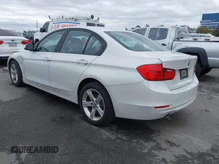 2015 BMW 3 Series 320i with VIN WBA3B1C5XFK137171, listed as a IAAI auction lot 41736278 with 28,673 mi miles. Bid and sale history available at carsss.com. Image 3.