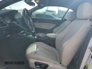 2016 BMW 2 Series 228i with VIN WBA1K9C52GV321798, listed as a Copart auction lot 45011725 with 56,673 mi miles and Salvage Title. Bid and sale history available at carsss.com. Image 7.